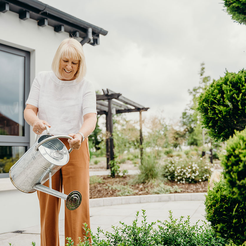 Woman-Watering-Plants-(1).jpg Woman-Watering-Plants-(1).jpg