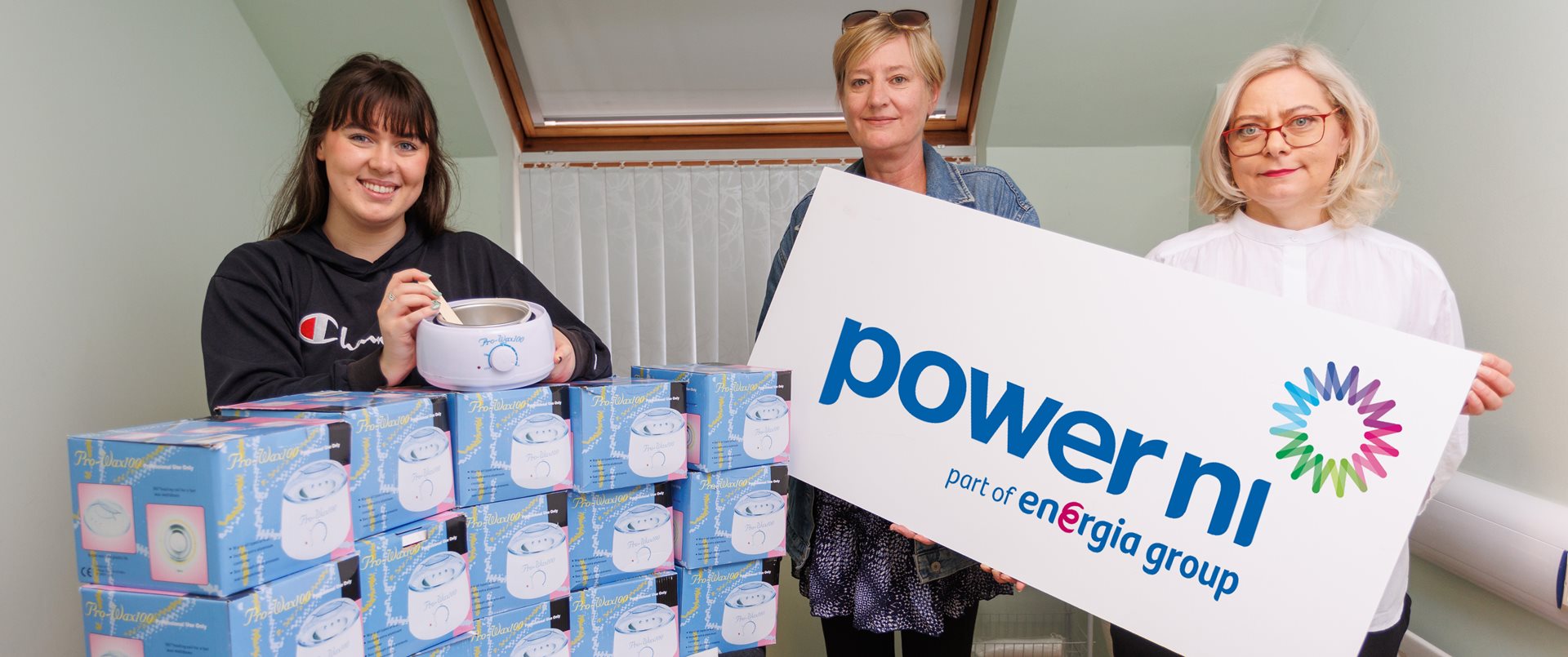 Power NI raise form at local community group with donation