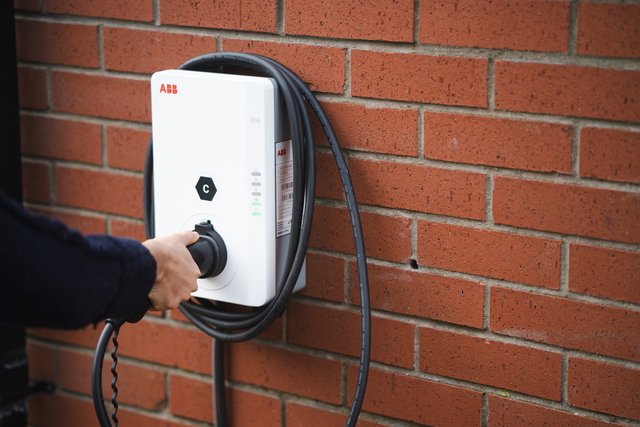 Tethered electric vehicle charger